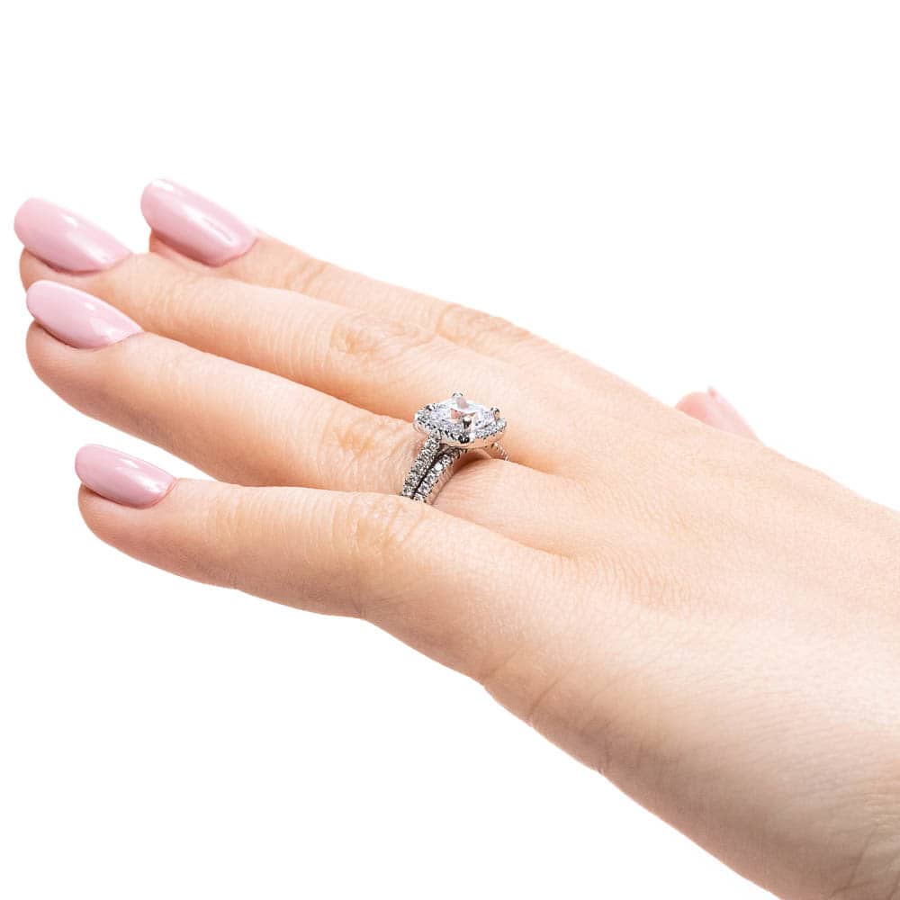 Shown with a 1.0ct Cushion cut Lab-Grown Diamond with a diamond accented halo and diamonds accenting the band in recycled 14K white gold with matching band, purchase the set for a discount | diamond halo accented engagement ring Shown with a 1.0ct Cushion cut Lab-Grown Diamond with a diamond accented halo and diamonds accenting the band in recycled 14K white gold with matching band