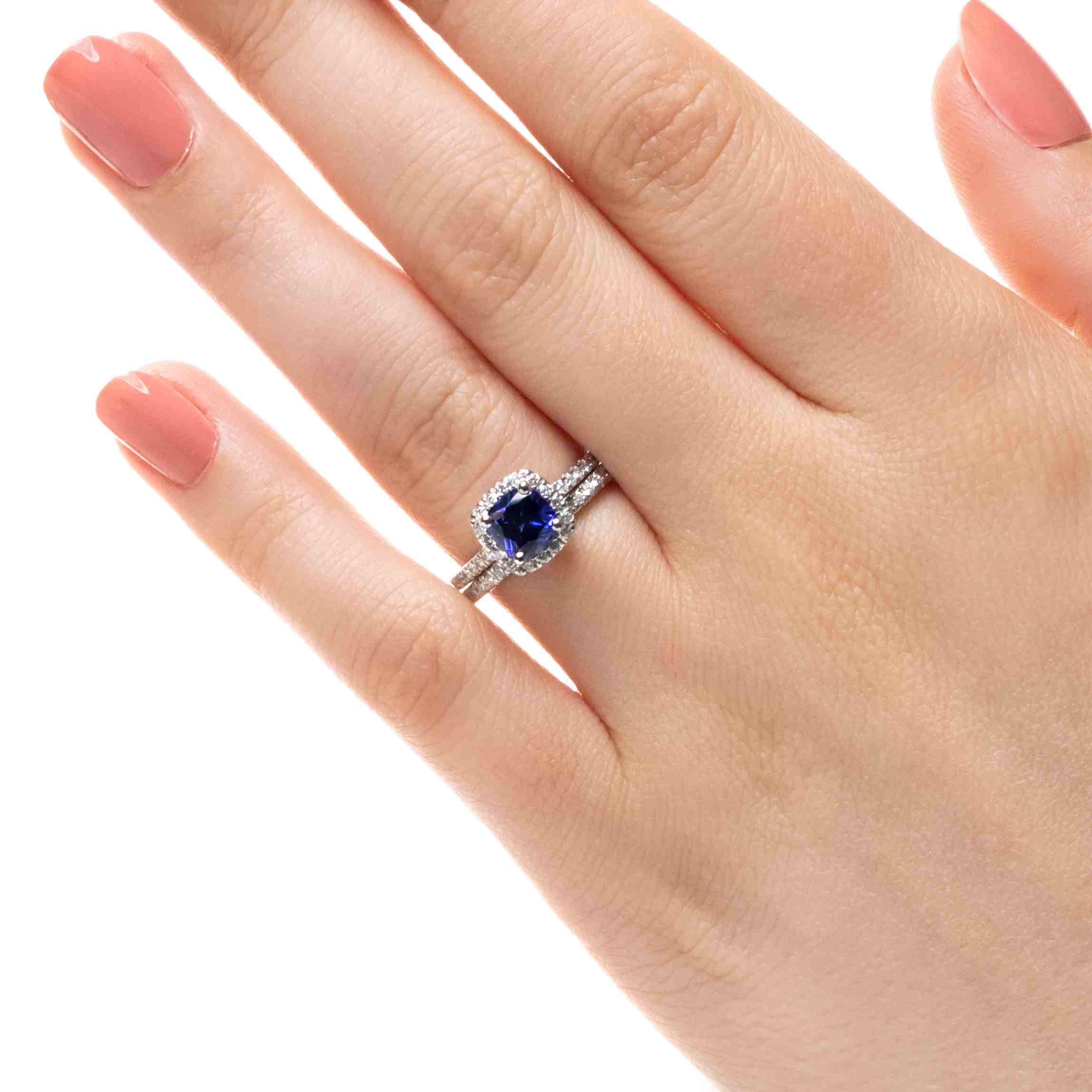 Shown with a 1.0ct Cushion cut Blue Sapphire Lab-Created Gemstone with a diamond accented halo and diamonds accenting the band in recycled 14K white gold with matching band, purchase the set for a discount | diamond halo accented engagement ring Shown with a 1.0ct Cushion cut Blue Sapphire Lab-Created gemstone with a diamond accented halo and diamonds accenting the band in recycled 14K white gold with matching band
