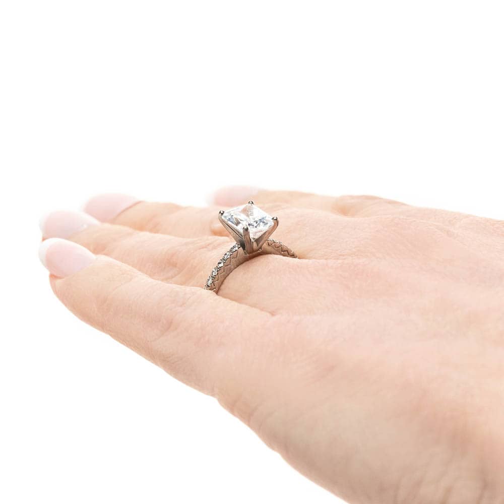 Shown with 1ct Radiant Cut Lab Grown Diamond in 14k White Gold|Diamond accented solitaire engagement ring with 1ct radiant cut lab grown diamond in 14k white gold worn on hand sideview