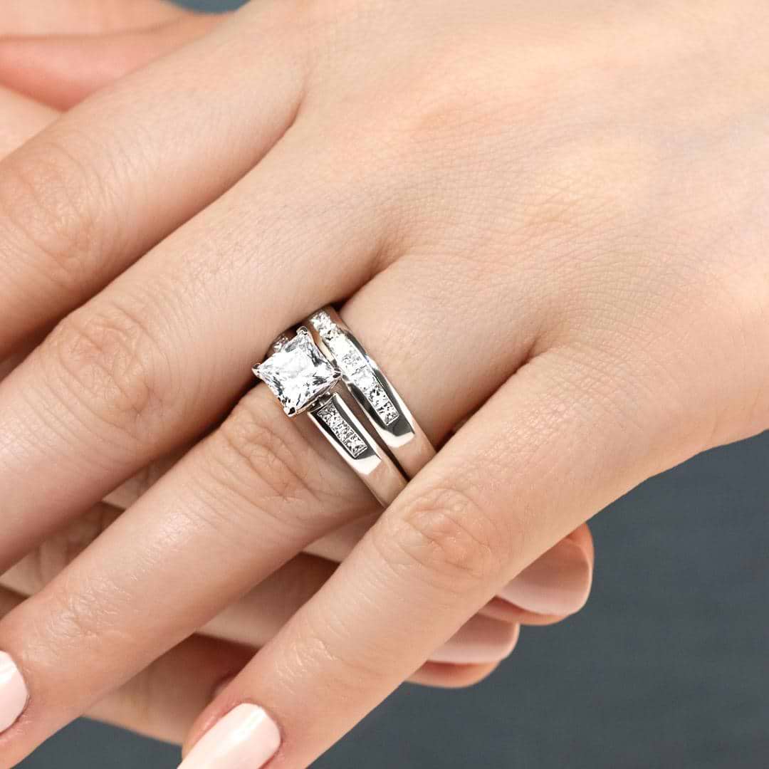 Melanie Wedding Set featuring a princess cut 1.50ct Diamond Hybrid® engagement ring in recycled 14K white gold with .30ctw side stones and a matching wedding band with .40ctw channel set stones | Melanie Wedding Set 1.50ct Diamond Hybrid engagement ring wedding band