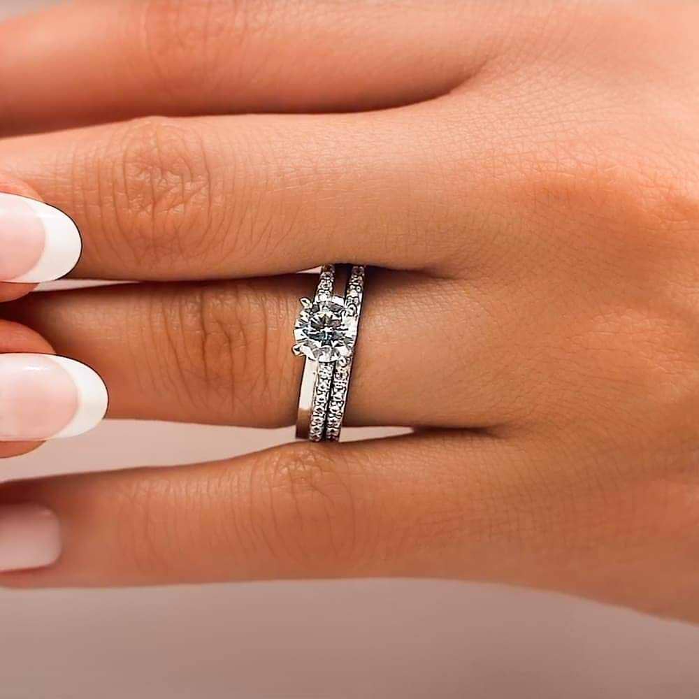 Shown with a 1.0ct Round cut Lab-Grown Diamond with accenting diamonds on the band in recycled 14K white gold with matching band, can be purchased together at a discounted price | diamond accented engagement ring Shown with a 1.0ct Round cut Lab-Grown Diamond with accenting diamonds on the band in recycled 14K white gold with matching wedding band