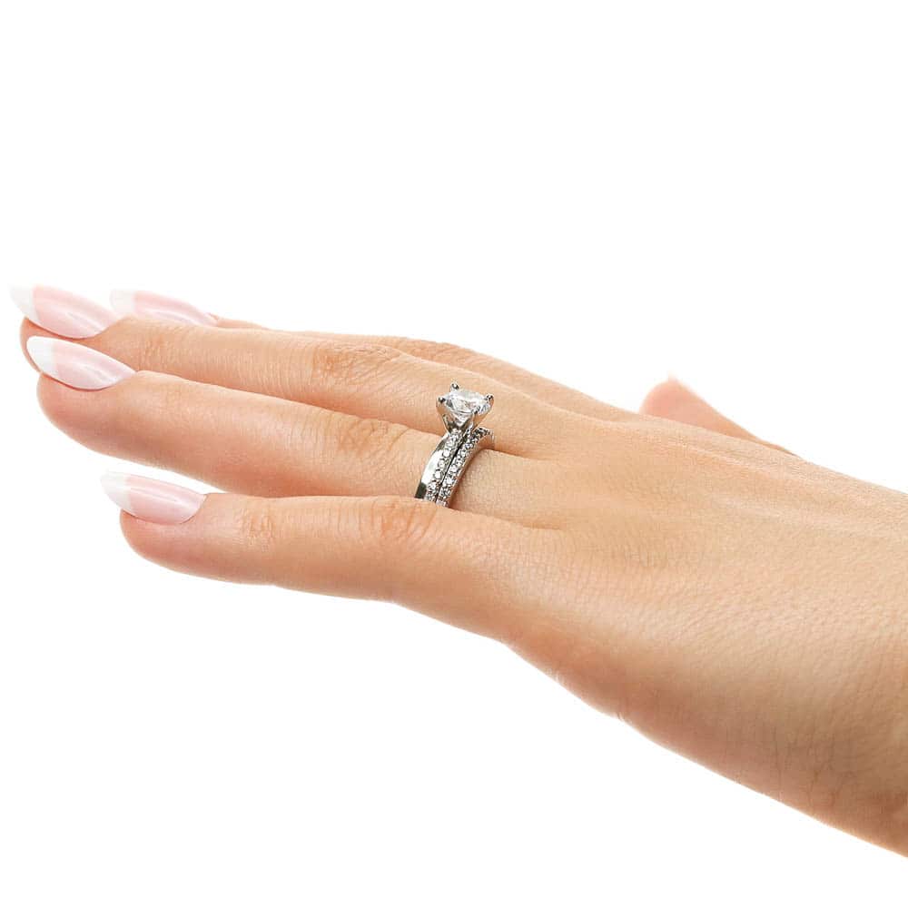 Shown with a 1.0ct Round cut Lab-Grown Diamond with accenting diamonds on the band in recycled 14K white gold with matching band, can be purchased together at a discounted price | diamond accented engagement ring Shown with a 1.0ct Round cut Lab-Grown Diamond with accenting diamonds on the band in recycled 14K white gold with matching wedding band