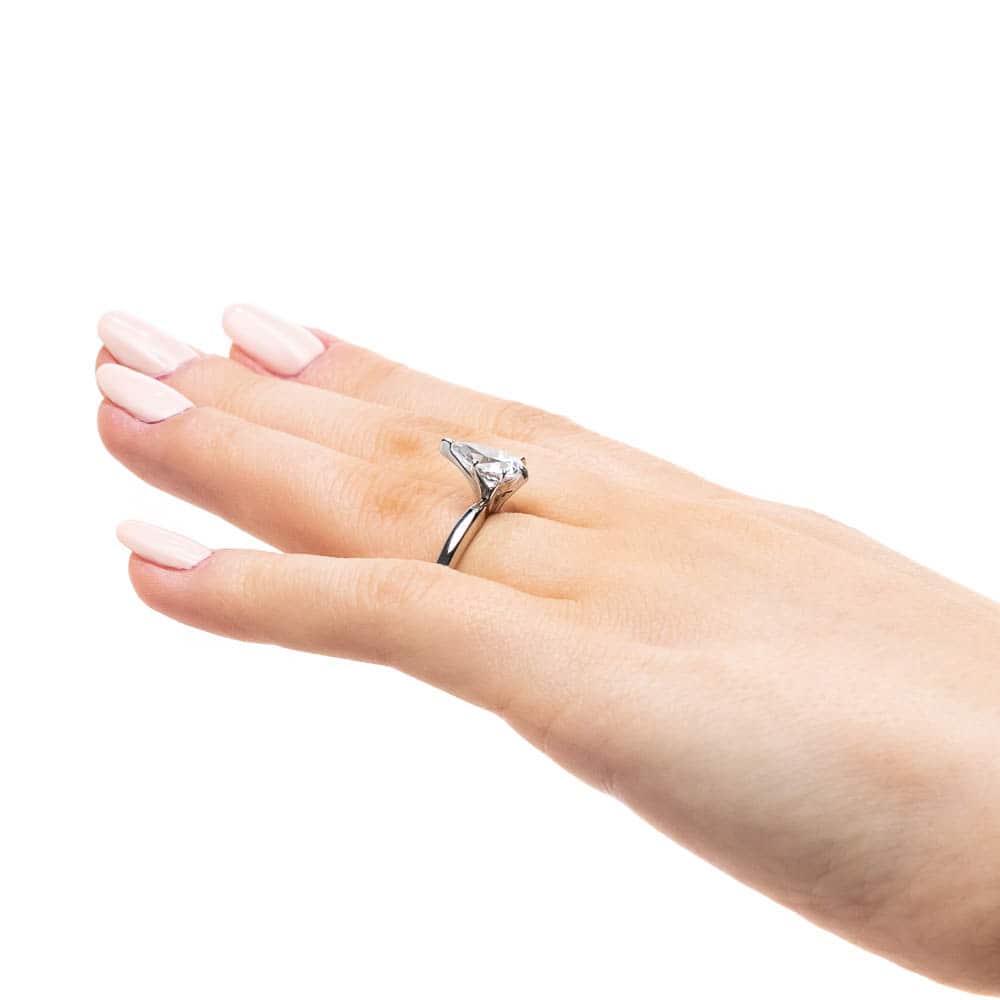 Shown with 1ct Pear Cut Lab Grown Diamond in 14k White Gold|Solitaire engagement ring with 6 prong set 1ct pear cut lab grown diamond in 14k white gold band worn on hand sideview