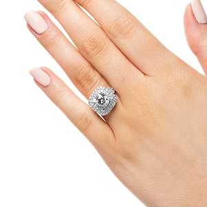 Split shank double halo engagement ring with diamond accents featuring a 1ct cushion cut lab grown diamond in 14k white gold worn on hand