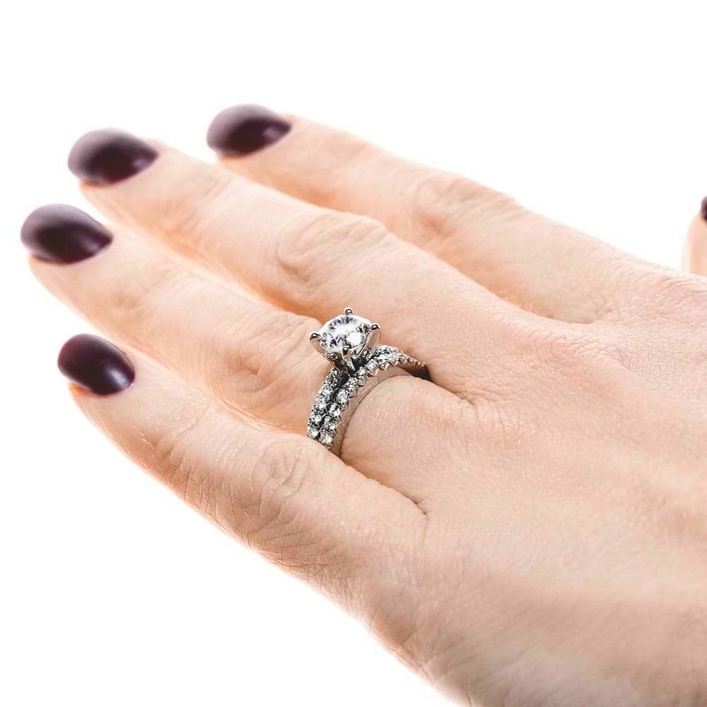Novu Wedding Set shown with a 1.0ct Round cut Lab-Grown Diamond with a diamond accented band in recycled platinum, can be purchased with the matching band as a set at a discounted price | Novu Wedding Set Shown 1.0ct Round cut Lab-Grown Diamond diamond accented band in recycled platinum matching band