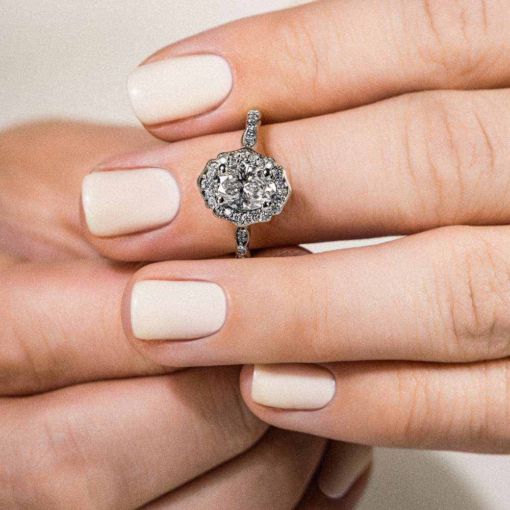 Shown In 14K White Gold with an Oval Cut Center Stone|vintage halo lab grown diamond ring with an oval cut lab grown diamond center stone 
