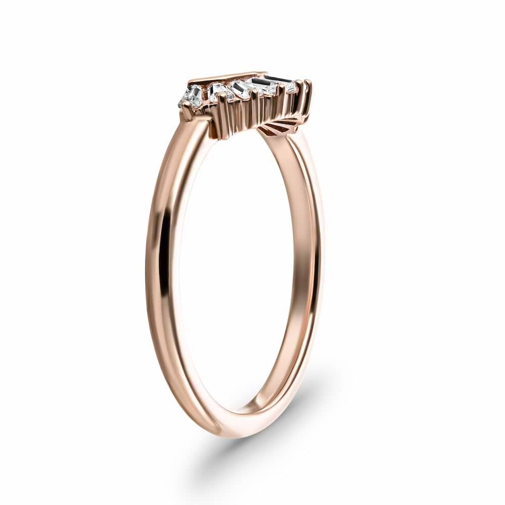 Shown in 14k Rose Gold|Elegant contour diamond accented wedding band with baguette cut lab grown diamonds in 14k rose gold shown from side