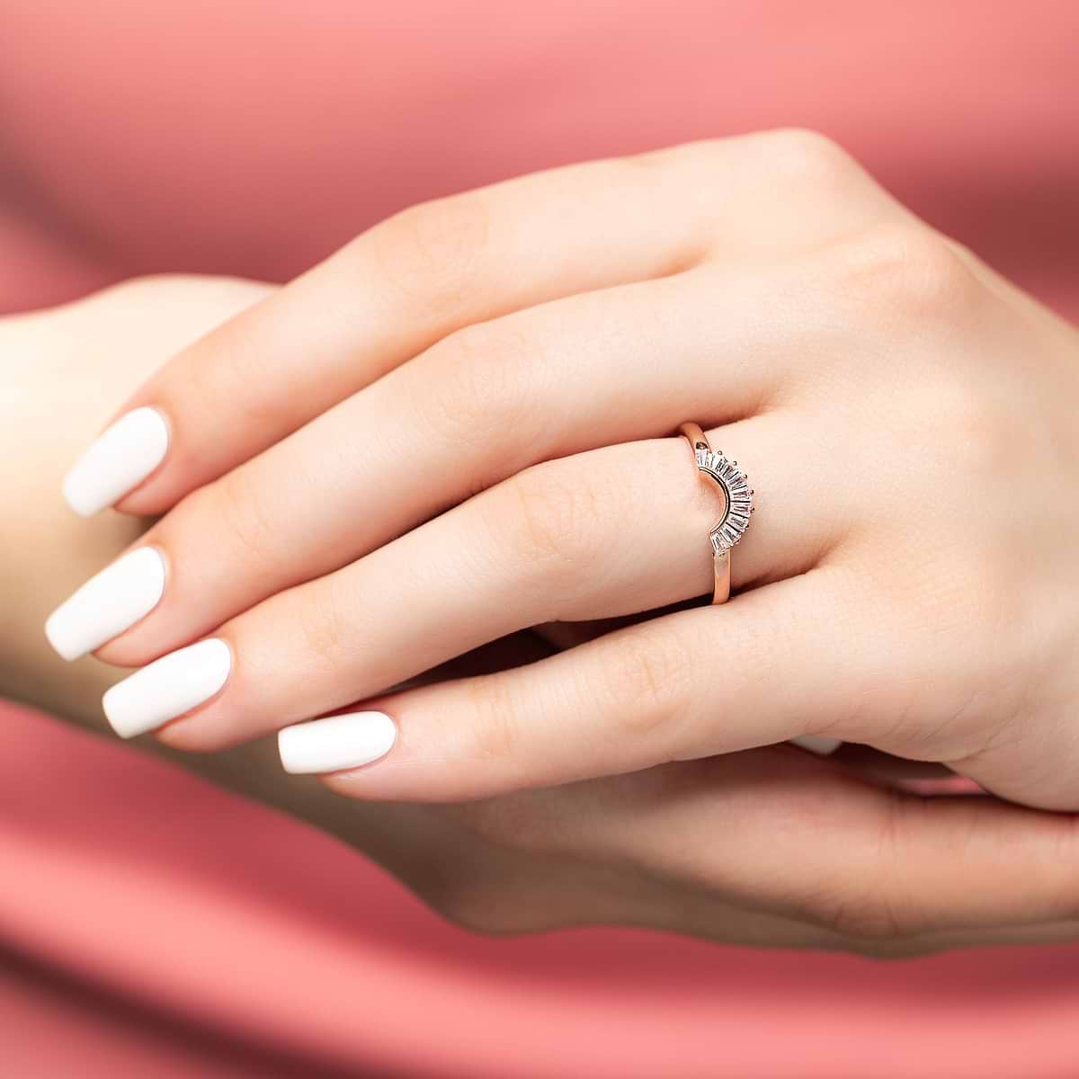 Shown in 14k Rose Gold|Elegant contour diamond accented wedding band with baguette cut lab grown diamonds in 14k rose gold shown from side