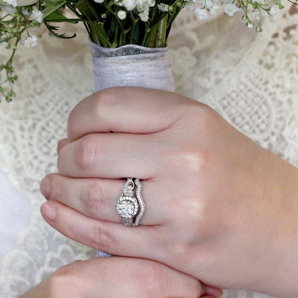 Shown here with the matching ring, can be purchased together for a discounted price| two tone engagement ring Shown with a 1.0ct Round cut Lab-Grown Diamond with diamond accented halo and filigree detailed band in recycled 14K white gold with matching wedding band