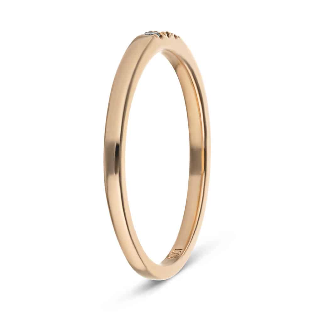 Three Lab-Grown Diamonds set in a simple band in recycled 10K rose gold 