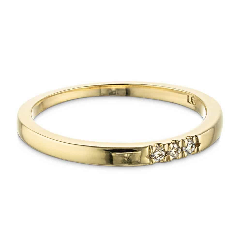 Three Lab-Grown Diamonds set in a simple band in recycled 10K yellow gold 