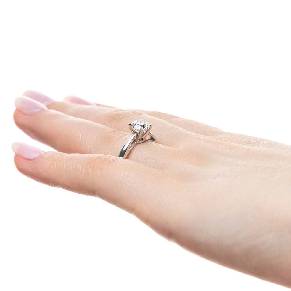 Shown with a 1ct Round Cut Lab Grown Diamond in 14k White Gold|Solitaire engagement ring with 1ct round cut lab grown diamond in cathedral style 14k white gold band worn on hand sideview