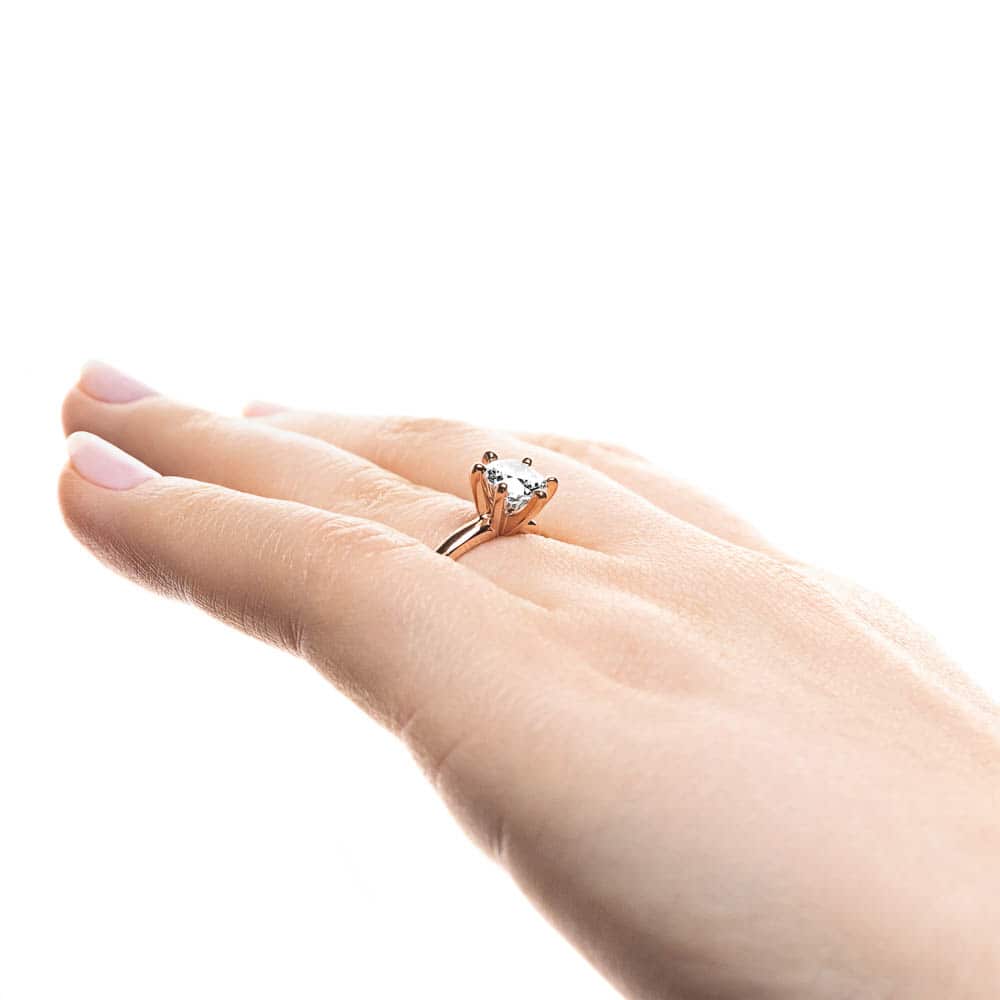 Shown here with a 1.5ct Round lab-grown diamond in a six prong rose gold setting. 