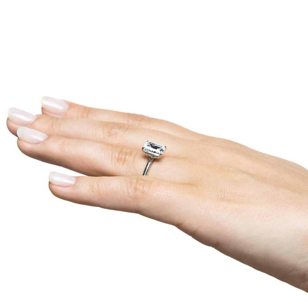 Shown with a 2.0ct Emerald cut Lab-Grown Diamond in recycled 14K white gold 