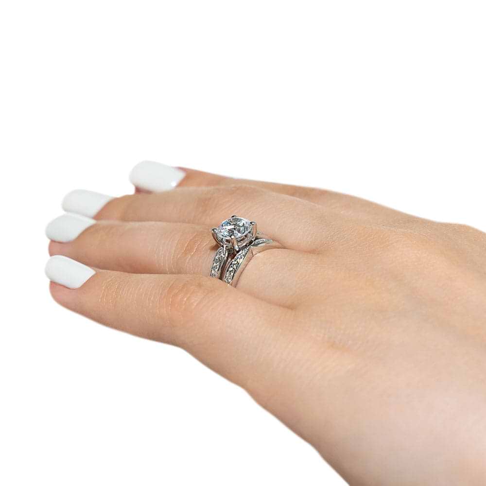 Unity Wedding Ring Set comes with your choice of round cut center stone accented with recycled diamonds channel set on engagement ring and wedding band's tapered shanks | unity wedding set recycled diamonds engagement ring wedding band