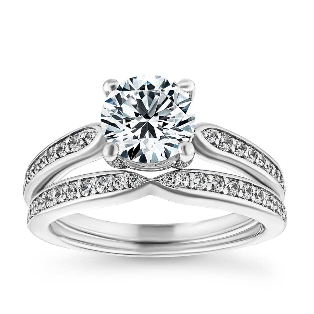 Unity Wedding Ring Set comes with your choice of round cut center stone accented with recycled diamonds channel set on engagement ring and wedding band&#39;s tapered shanks 