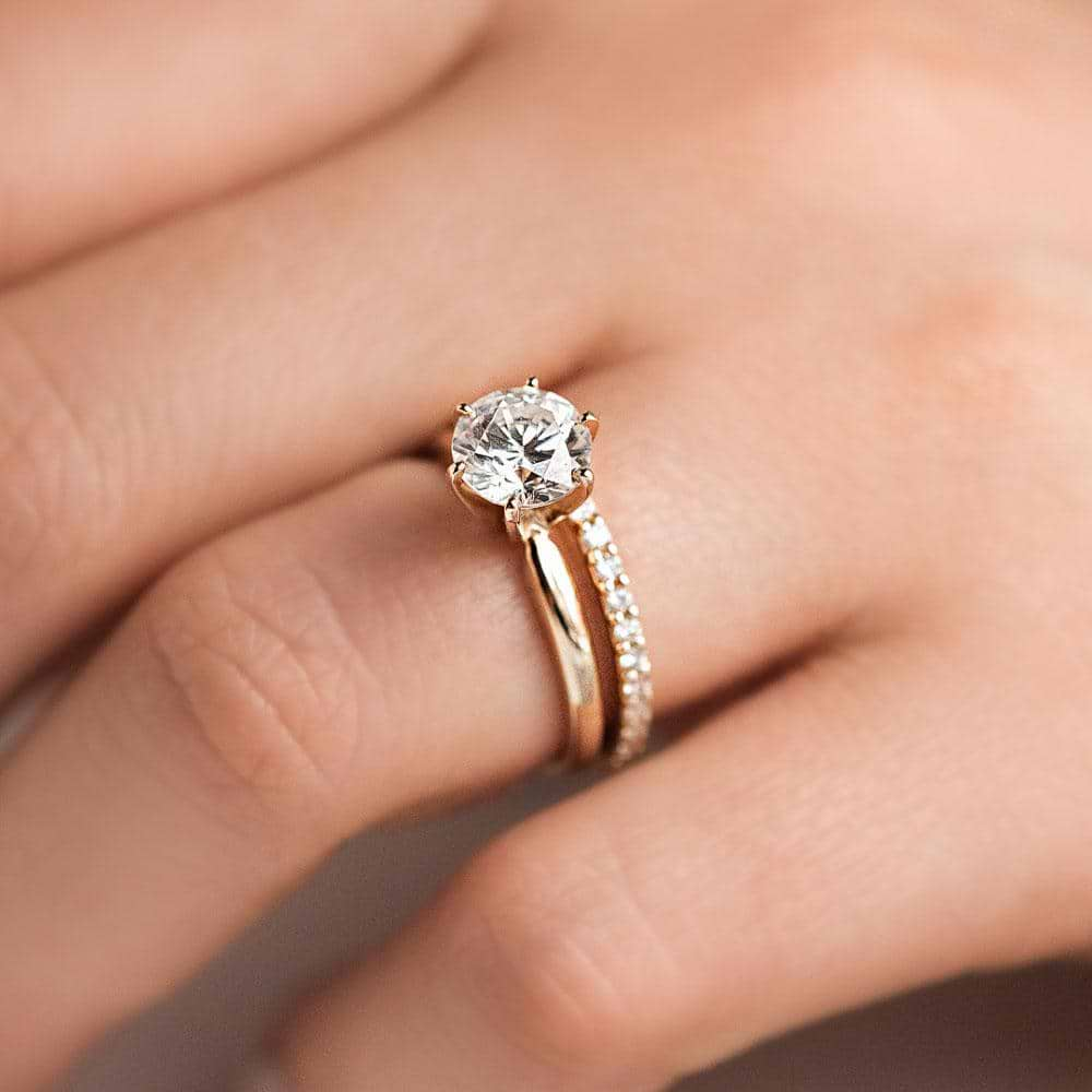 Diamond accented wedding band paired with a Traditional Solitaire Engagement ring in 14K rose gold 