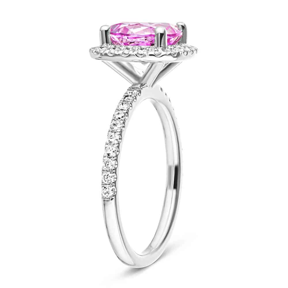 Shown with a 2.75ct Round cut Pink Sapphire Lab Created Gemstone with a diamond accented halo and accented band in recycled 14K white gold 