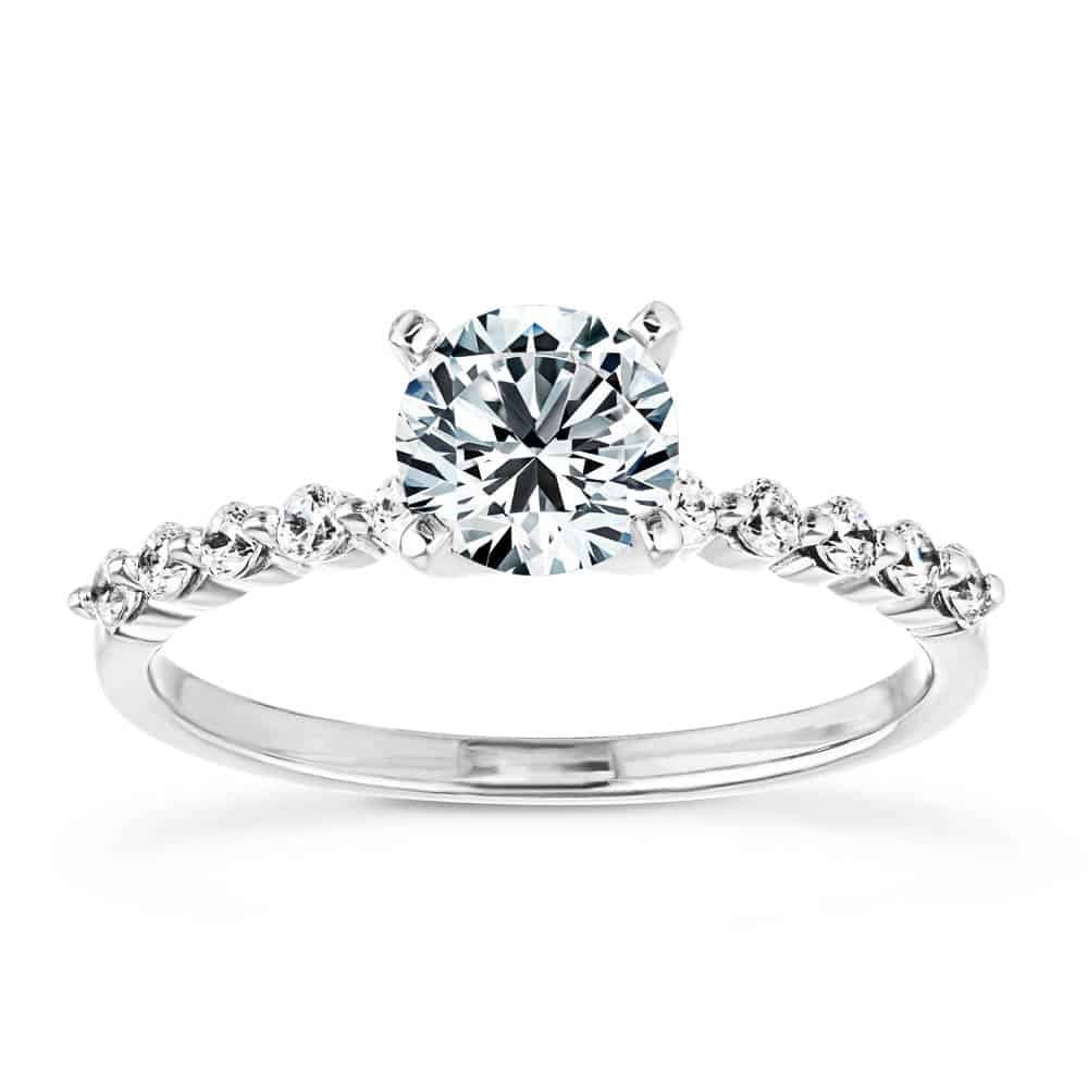 Shown with a 1.0ct Round cut Lab-Grown Diamond with accenting diamonds on the band in recycled 14K white gold 