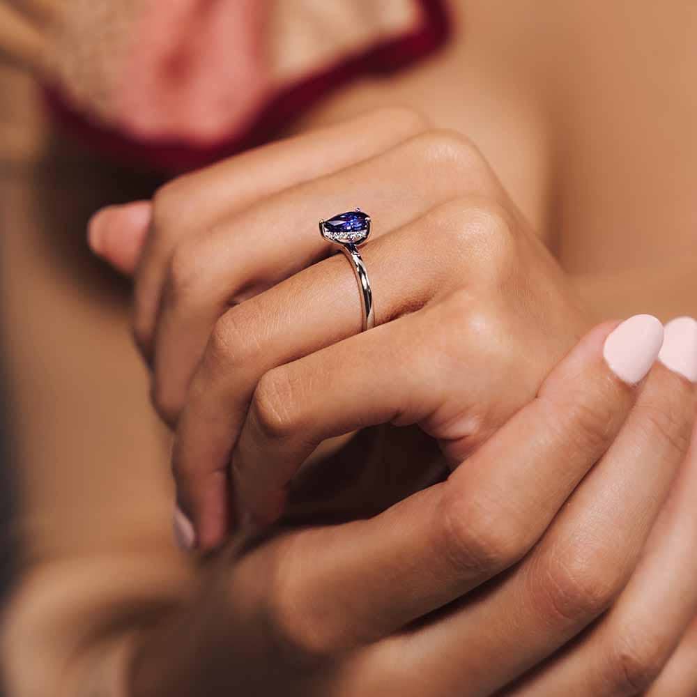 Shown with 1ct Pear Cut Lab Grown Blue Sapphire in 14k White Gold