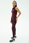 A woman wears the SPLITS59 Amber Airweight High Waist 7/8 leggings in Dark Cherry/Indigo against a plain white background.