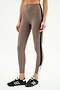 Model wears SPLITS59 Layla Airweight High Waist 7/8 leggings in Lentil/Black, showcasing ultra-soft fabric and black side stripe with black athletic shoes—ideal for hot yoga or daily wear, set against a plain white background.