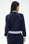 A person with long dark hair is shown from the back wearing the SPLITS59 Hayes Varsity Rigor Jacket in Indigo, made from stretch fabric, against a plain light background.