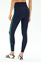 Model shown from the back wears SPLITS59 Amber Airweight High Waist 7/8 leggings in Indigo/Spearmint, made from a soft nylon-spandex blend, paired with white athletic shoes against a plain background.