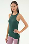 A woman poses with one hand on her hip, wearing the SPLITS59 Kiki Rib Tank Full Length - Military and mauve leggings with green stripe—ideal for yoga or running—against a plain white background.