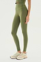 A person wearing the SPLITS59 Airweight High Waist Legging in Olive and beige sneakers is standing against a plain white background.