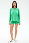 A woman faces forward against a white background, wearing the SPLITS59 Andie Oversized Fleece Sweatshirt in Spearmint with matching green shorts and white sneakers featuring green stripes.