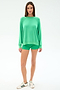 A woman faces forward against a white background, wearing the SPLITS59 Andie Oversized Fleece Sweatshirt in Spearmint with matching green shorts and white sneakers featuring green stripes.