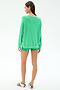A woman faces away, wearing the SPLITS59 Andie Oversized Fleece Sweatshirt in Spearmint with matching shorts and white sneakers with black stripes, set against a plain white background.