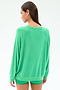 A woman with straight brown hair wears the SPLITS59 Andie Oversized Fleece Sweatshirt in Spearmint, paired with matching shorts, as she stands facing away from the camera against a plain white background.