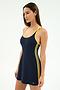 A woman wears the SPLITS59 Ella Airweight Dress in Indigo/Bright Yellow, featuring a nylon-spandex blend, yellow trim, and double yellow side stripes, standing against a plain white background.