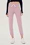 Front view of woman wearing light pink sweatpant jogger with white drawstring and black turtleneck cropped long sleeve paired with white shoes