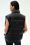 A person with long dark hair is seen from behind wearing the SPLITS59 Summit Nylon Puffer Vest in black, featuring lightweight insulation and a high collar, against a plain light background.
