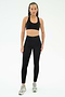 A person faces forward in SPLITS59's Airweight High Waist 7/8 Pocket Legging - Black, a black sports bra, and gray athletic shoes, pictured against a plain white background.