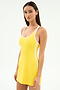 A woman wears the SPLITS59 Ella Airweight Dress in bright yellow with white trim and side stripes, made from stretch material, posing against a plain white background.