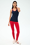 A woman stands against a plain background wearing the SPLITS59 Ashby Rib Tank in Indigo/Pirate Red—ideal for gym workouts or yoga sessions.
