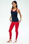 A woman stands against a plain background wearing SPLITS59's Ashby Rib Tank in Indigo/Pirate Red—an ideal choice for gym workouts or yoga sessions.