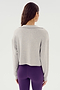 A person with long hair, seen from the back, wearing the SPLITS59 Joan Fleece Polo Sweatshirt in Heather Grey and purple high-waisted spandex leggings.