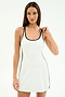 A woman wearing the SPLITS59 Ella Airweight Dress in white/black, made from soft nylon spandex, stands against a plain background and looks at the camera with a neutral expression.