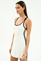 A woman wears the SPLITS59 Ella Airweight Dress in White/Black, a smooth nylon-spandex sleeveless dress with black trim and side stripes, standing against a plain white background.