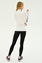 A person standing in a side pose, wearing a SPLITS59 Jackson Rib Full Length Turtleneck - White/Indigo and black leggings with black sneakers on a plain white background, ready for yoga or Pilates.