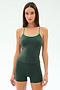 A woman poses against a plain background wearing the SPLITS59 Airweight Tank in Military/Spearmint, a dark green, spaghetti strap athletic top crafted from stretchy nylon spandex.