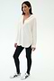 A woman stands against a white background wearing the SPLITS59 Kate Airweight Lite Button Down in white, paired with black leggings and white sneakers with black accents—an ideal lightweight layer for effortless style.