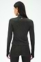 A woman facing away from the camera wears the SPLITS59 Stevie Active Rib Half Zip Waist Length top in Heather Graphite, paired with matching leggings, against a plain background.