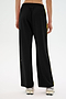 Individual wearing SPLITS59's Maxie Rigor Track Pant in Black/Chartreuse with white sneakers, captured from behind.
