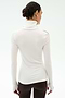 A woman with dark hair in a bun models the SPLITS59 Jackson Rib Full Length Turtleneck in White/Dark Chocolate with brown pants, shown from the back against a plain light background.